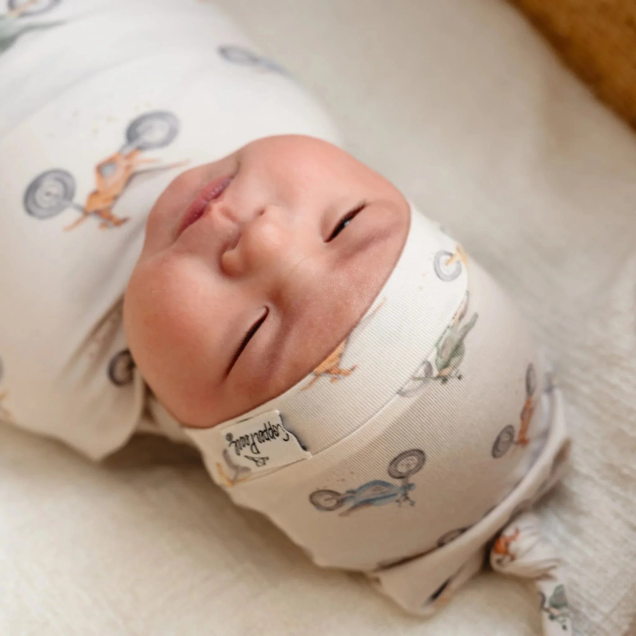 Copper Pearl Baby Ryder Top Knot Hat