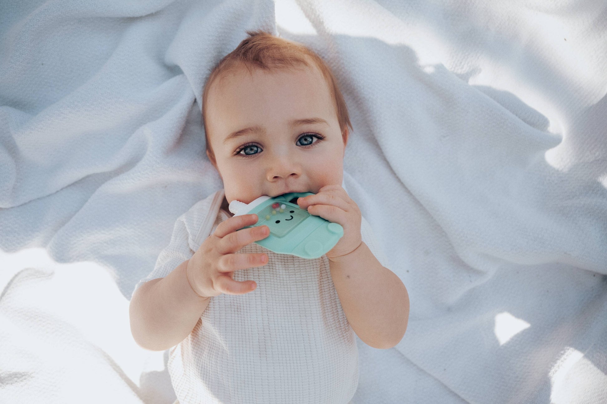 Itzy Ritzy Baby Sweetie Shake Plus™ - Teething + Rattle Toy: Croissant