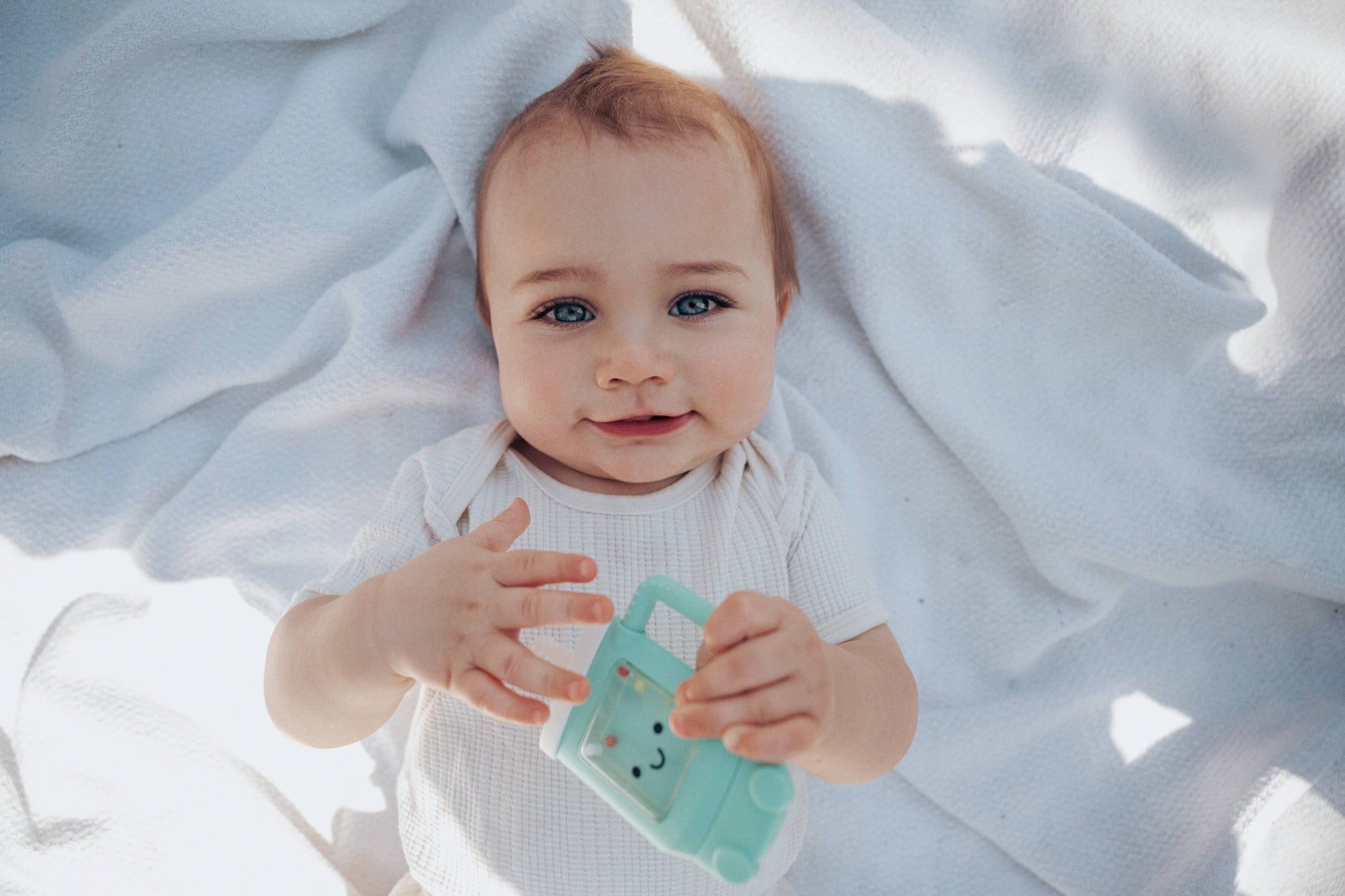 Itzy Ritzy Baby Sweetie Shake Plus™ - Teething + Rattle Toy: Croissant