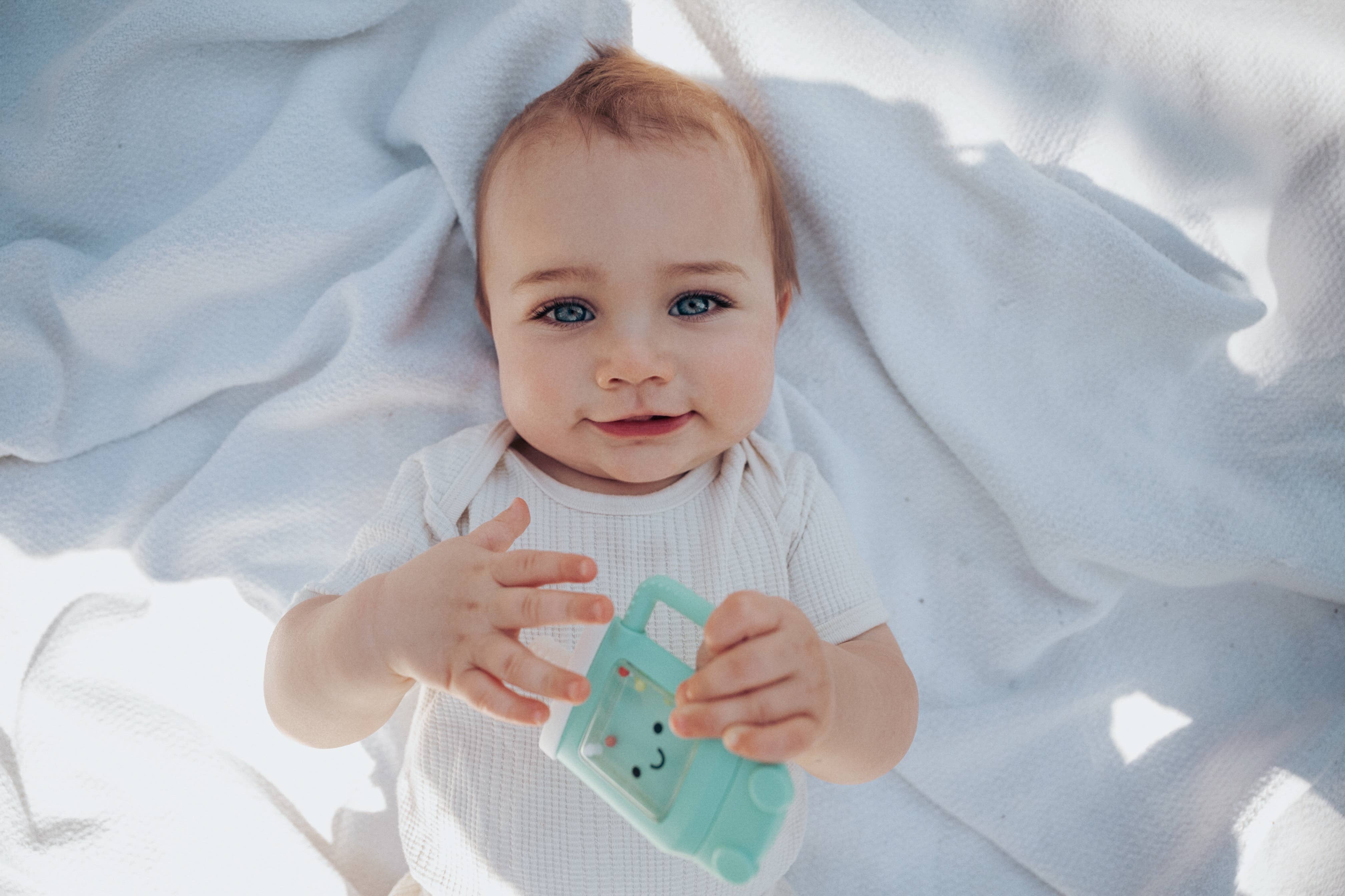 Itzy Ritzy Baby Sweetie Shake Plus™ - Teething + Rattle Toy: Croissant