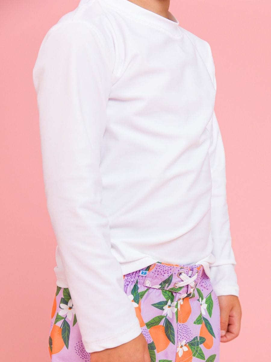 RuffleButts + RuggedButts Baby Long Sleeve Rash Guard, White