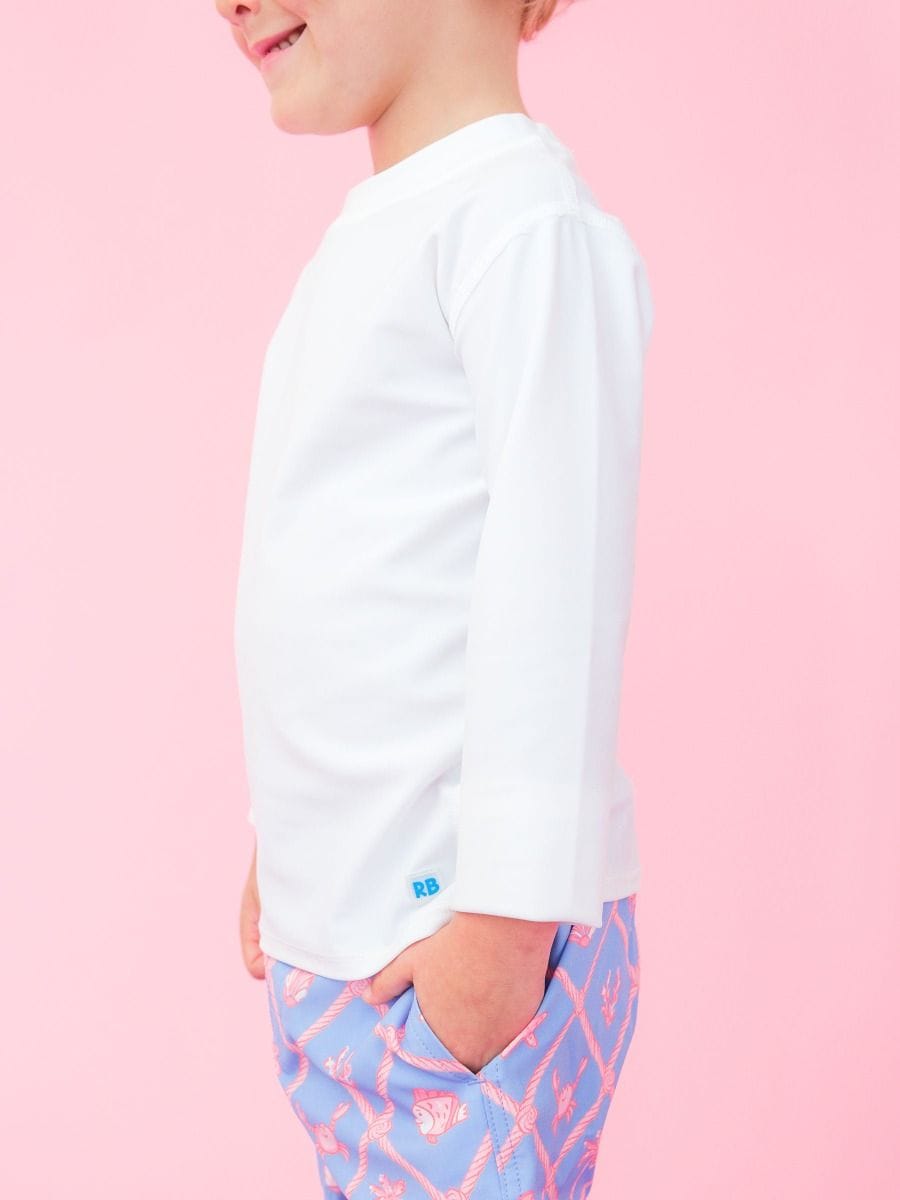 RuffleButts + RuggedButts Baby Long Sleeve Rash Guard, White